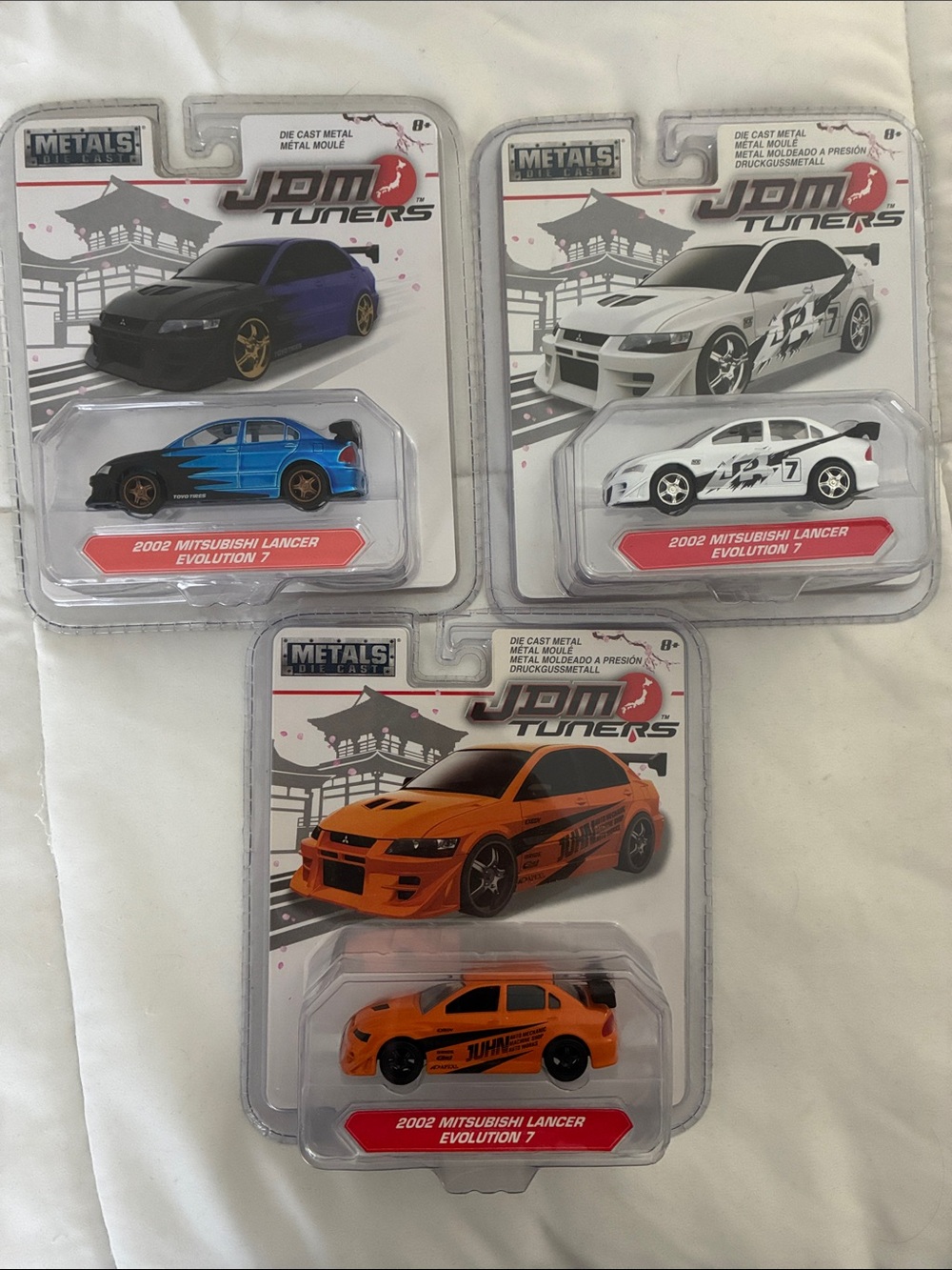 (3) bundle of 2002 Mitsubishi Lancer Evolution 7 Die-Cast Cars